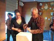 Student observing a stone carver