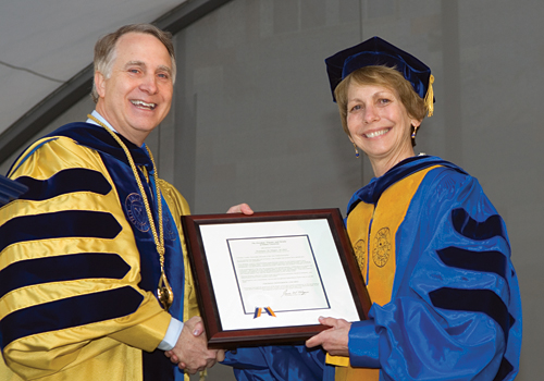 Rosemary Magee receiving her award from President Wagner