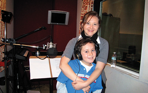 Snapshot of Gregory and actor in a sound booth